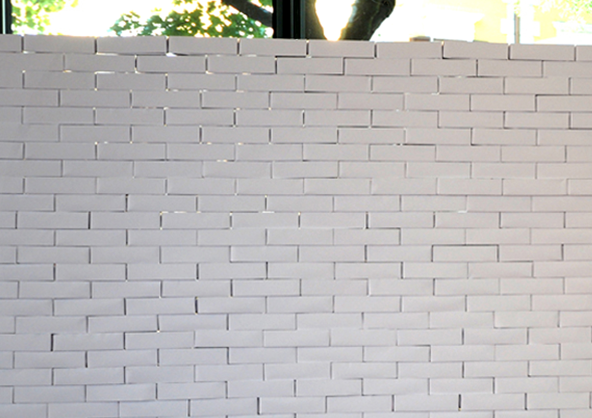 PAPER RELIGIONS  # THE WALL, 533 origami bricks, 533 sheets of paper, 8 days of work, 12 collaborators, 320 x 186 cm. Manifesta7 Parallel event, Festival “Città al muro”, University of Economics of Trento, 2008